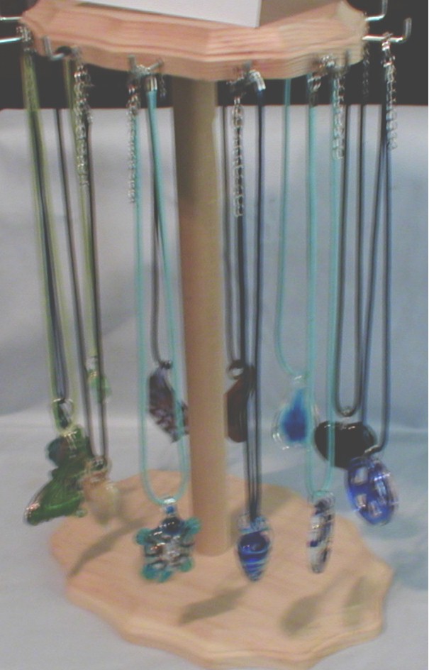 Display With Arte Glass Pendant Necklaces
